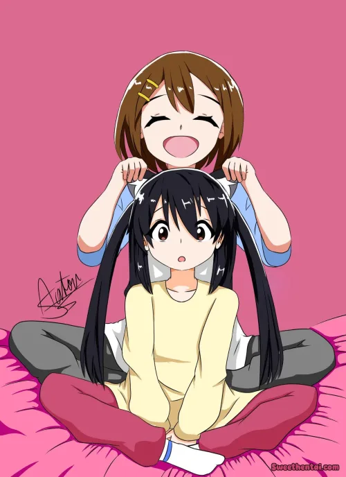 Yui having fun with Azu-nyan's ears